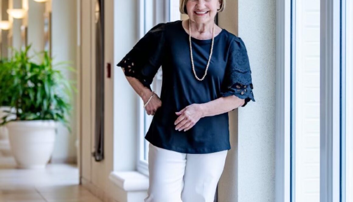 Woman smiling in hallway