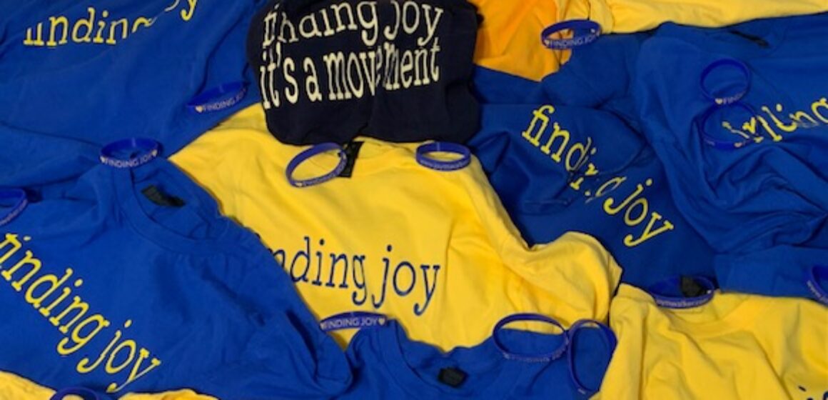 Finding Joy T shirts scattered