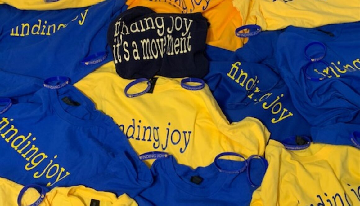 Finding Joy T shirts scattered