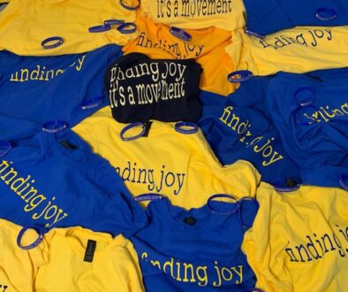 Finding Joy T shirts scattered