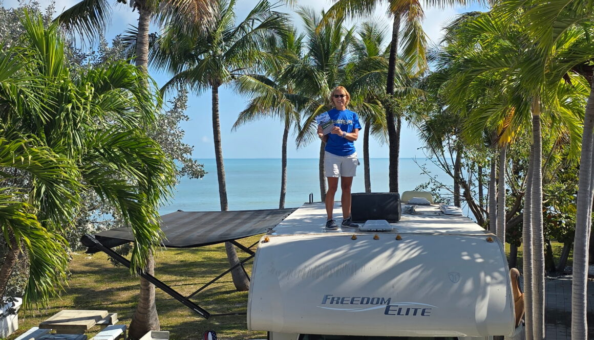 Standing on motorhome with book