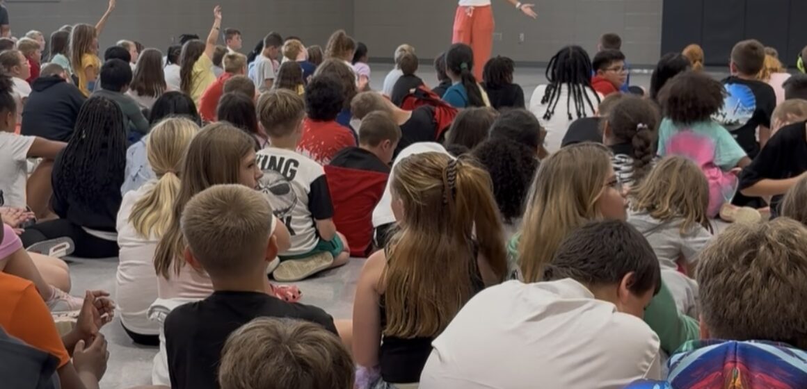 Joy talking to students Speaking to students
