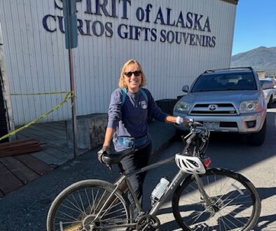 Joy with bike in Alaska