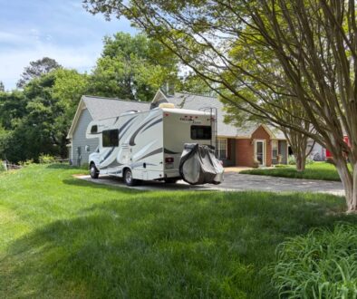 Motor home in front of home