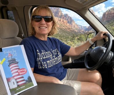 Joy in her rig with her manuscript